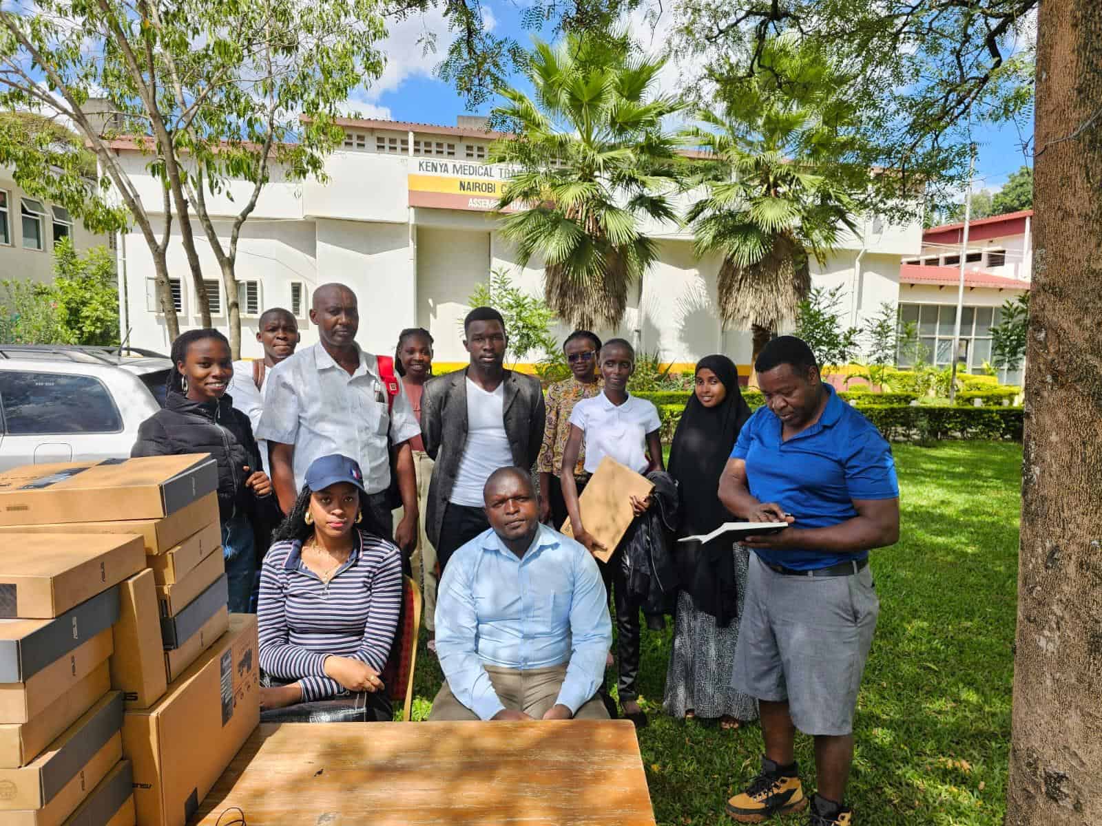 handing-over-laptops-at-kmtc20