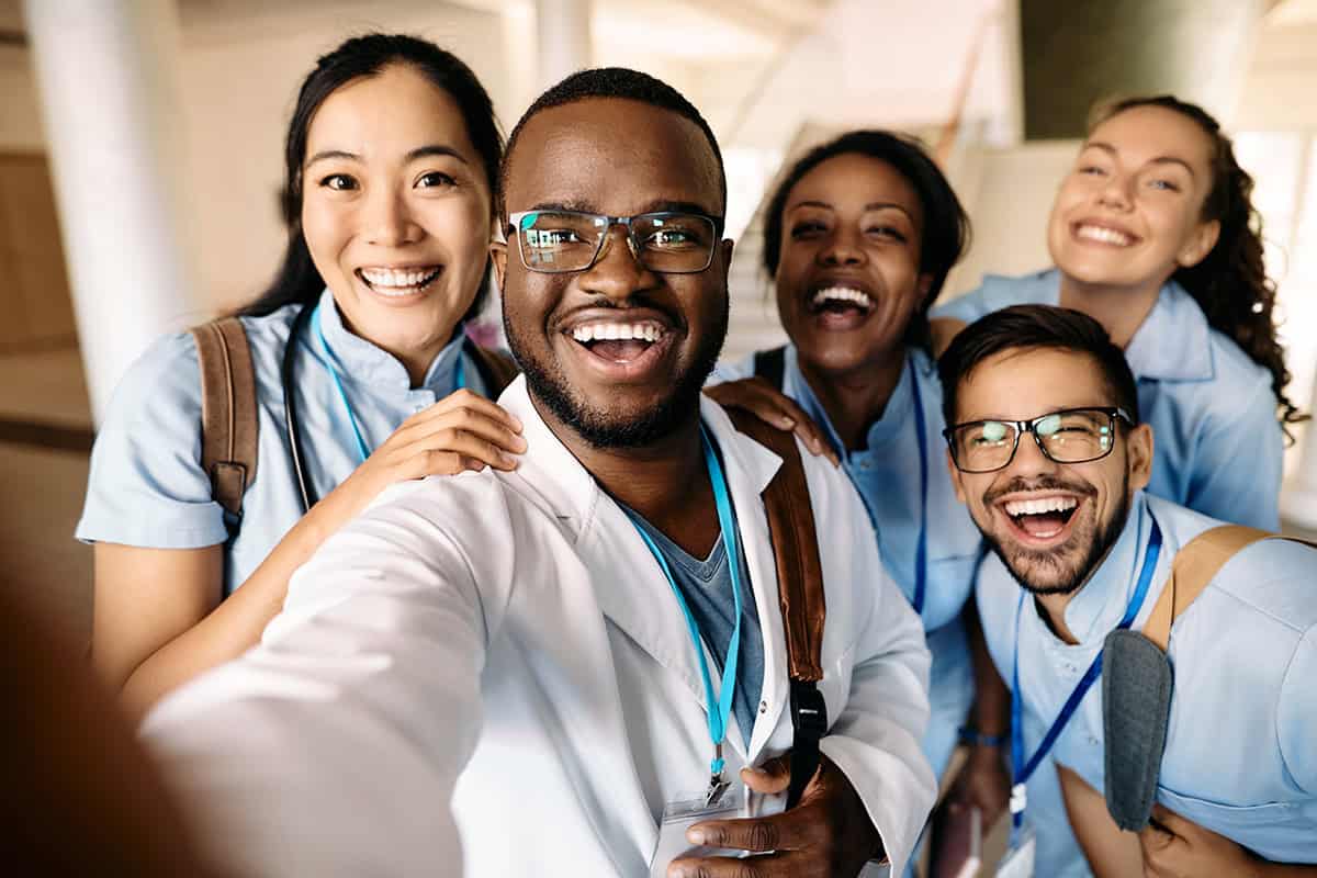 Multi-ethnic,Group,Of,Happy,Students,Having,Fun,Wile,Taking,Selfie